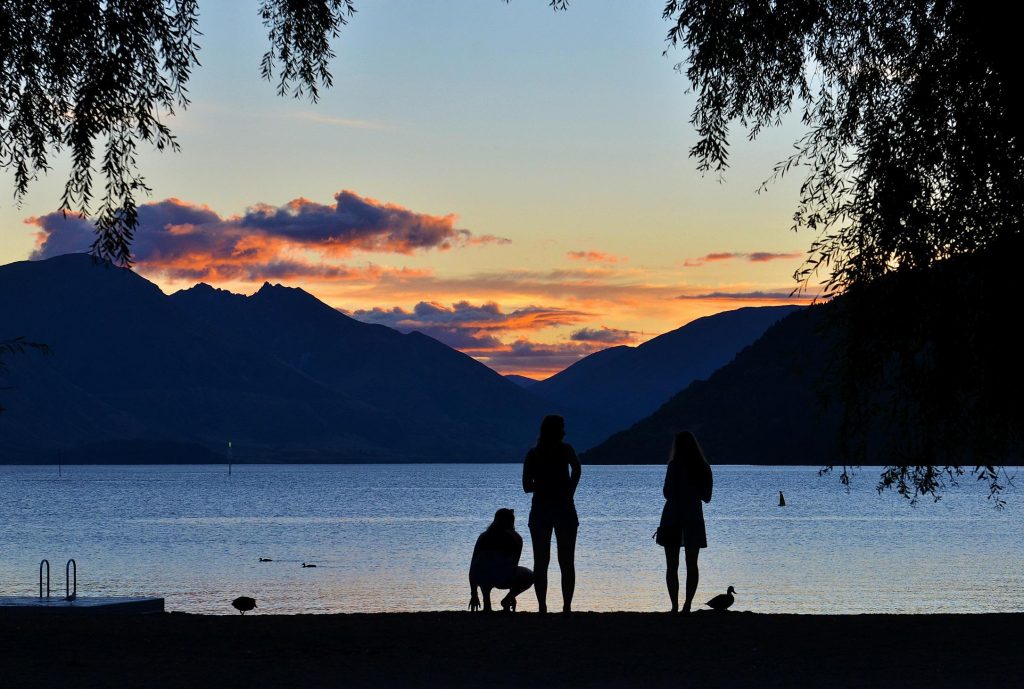Silhouette of a family at a lake