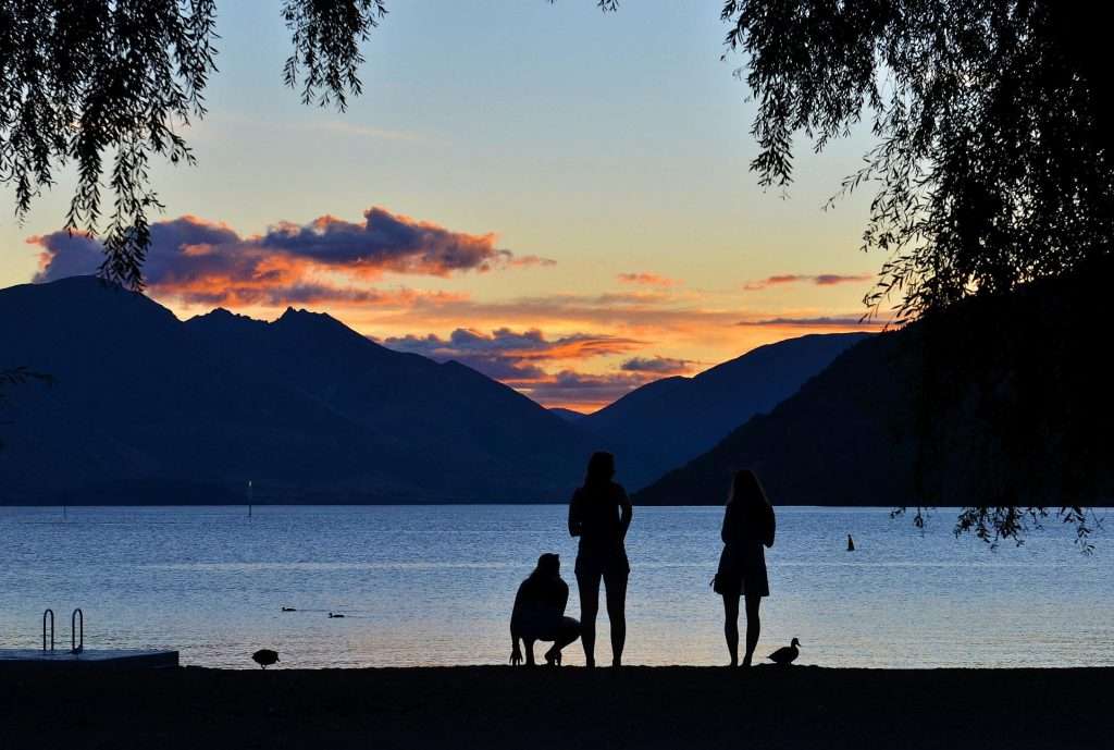 Silhouette of a family at a lake